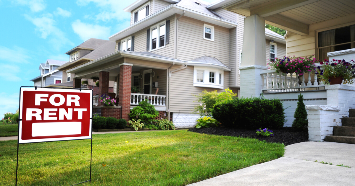 Home For Rent Sign in Front of Beautiful American Home