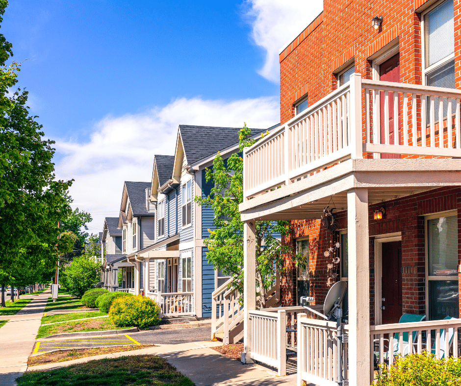 A series of modern houses and apartment buildings on a suburban street in Denver, Colorado.