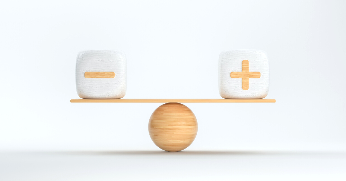 Wooden scale balancing cubes with plus and minus symbols