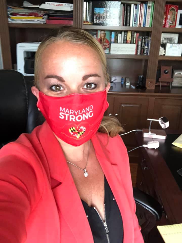 Woman in an office with a Maryland Strong Mask on