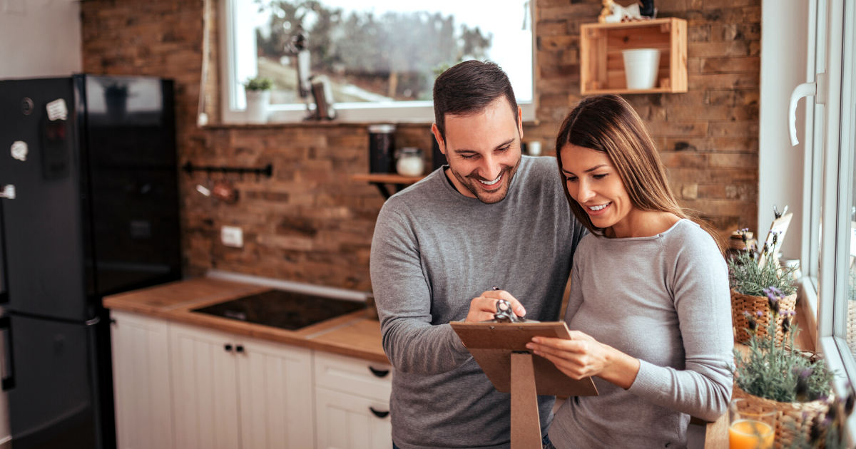 Couple making plans for interior renovation in cozy winter home