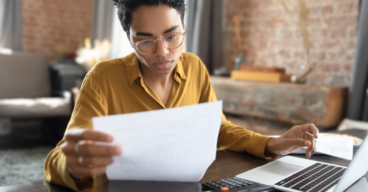 Focused young woman managing financial affairs