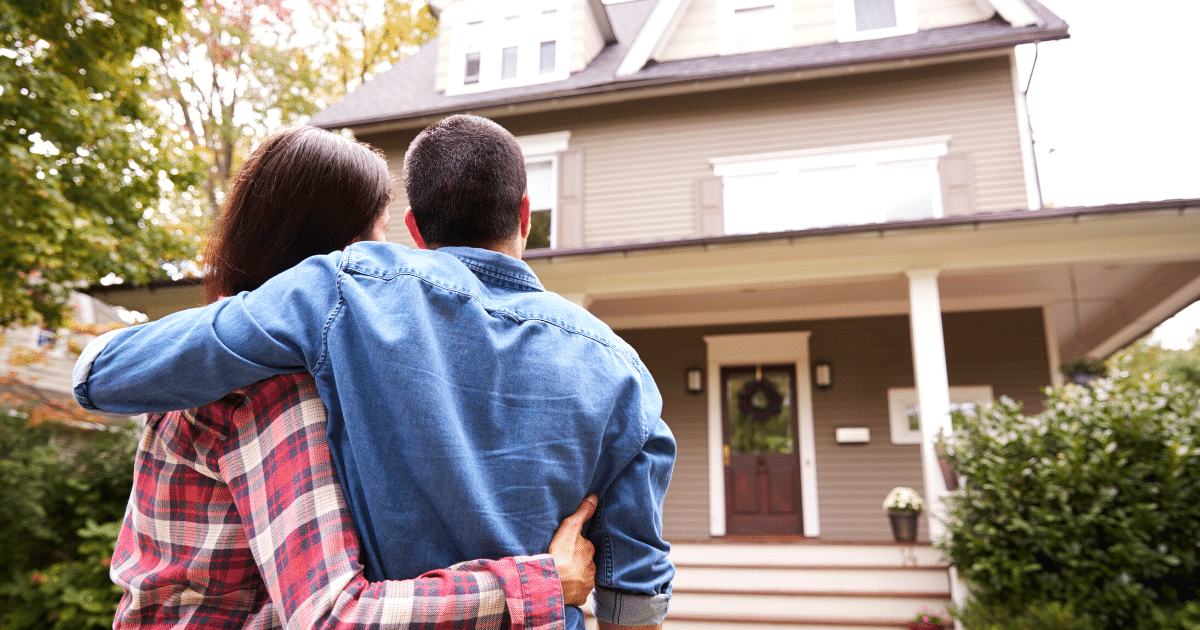 loving-couple-walking-towards-new-house Rear View Of Loving Couple Walking Towards House
