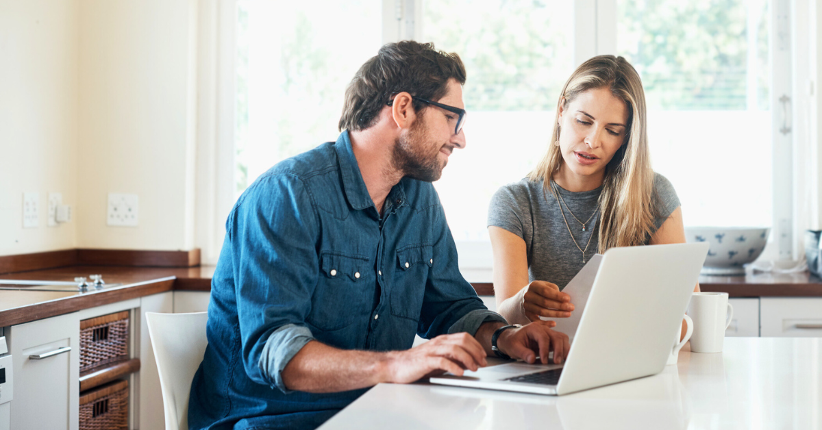 Shot of a young couple working on their finances together at home