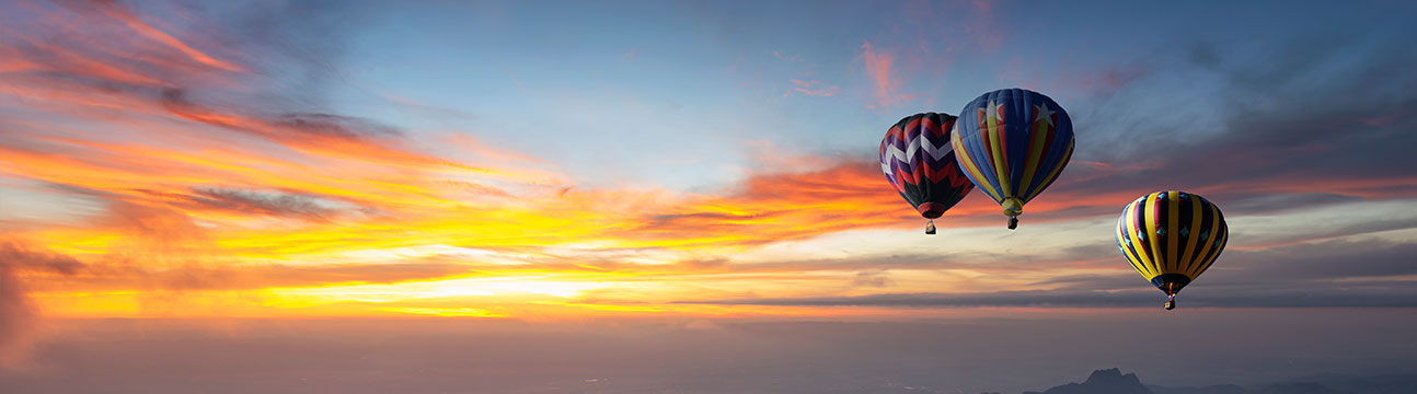 Hot air balloons in the air during sunset