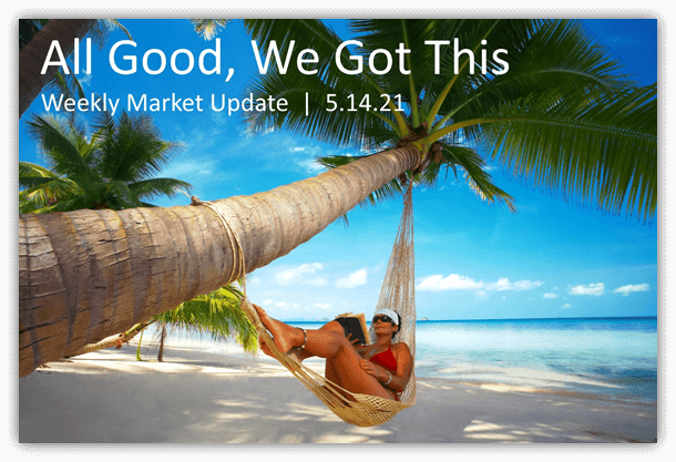 A woman sitting in a hammock on the beach