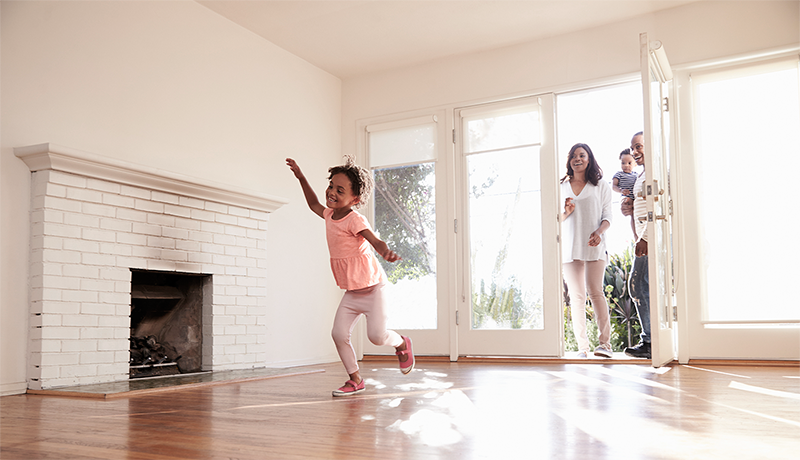 excited family entering new home