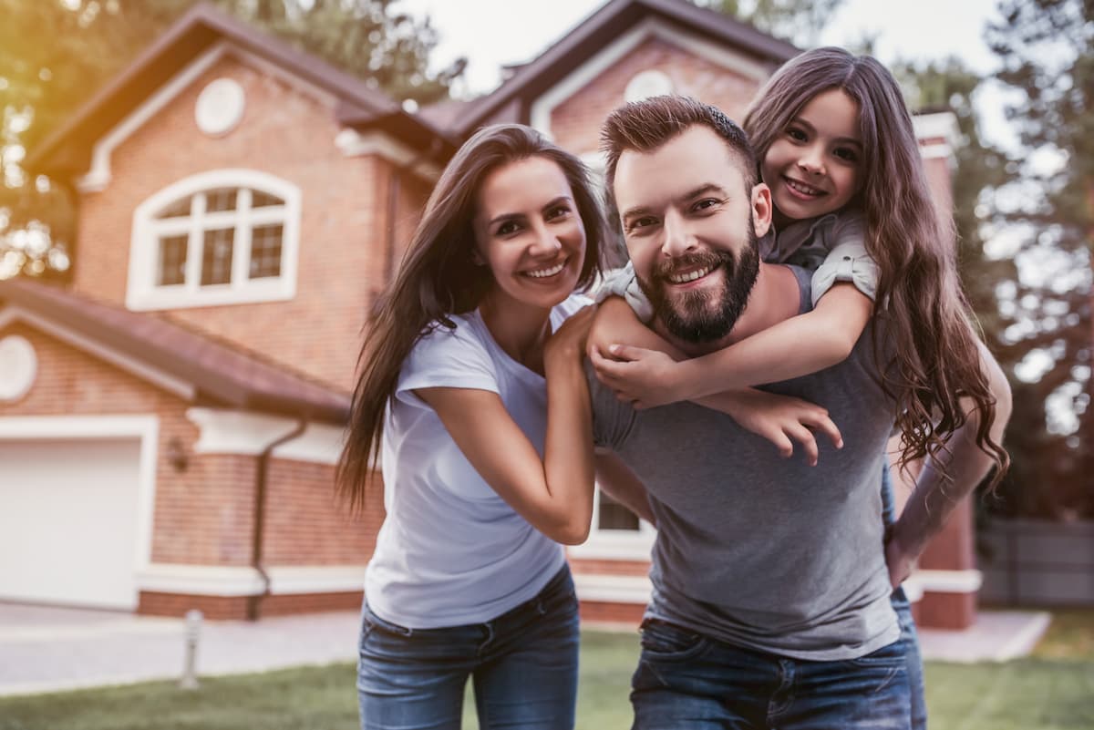 Family in front of home